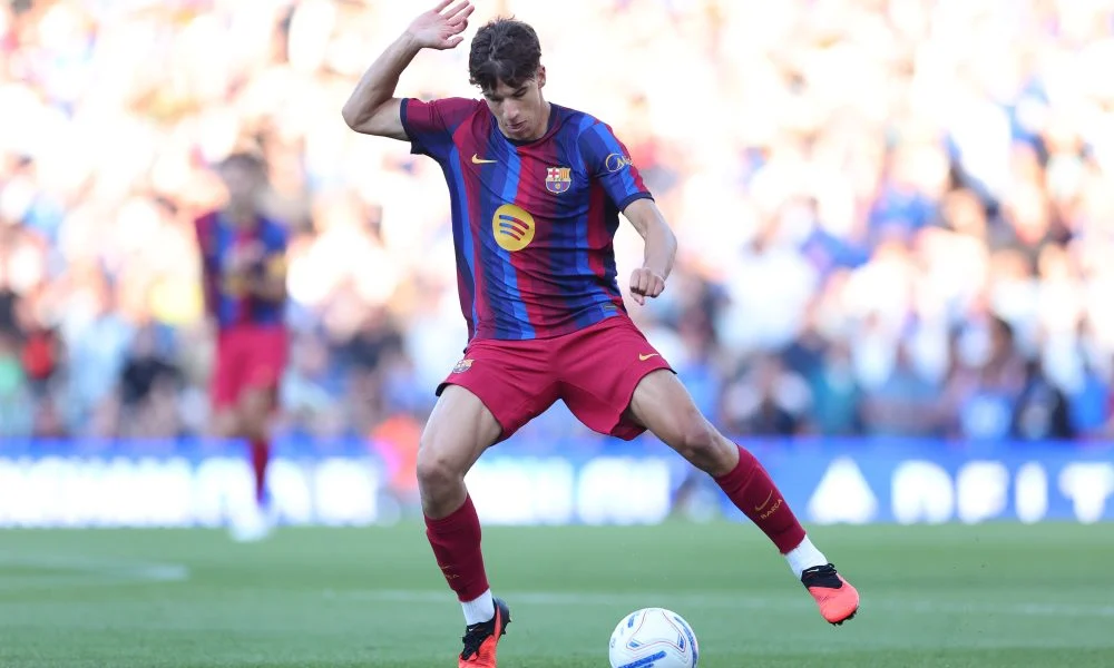 Logo klub Barcelona dan AFC Ajax dalam bursa transfer pemain