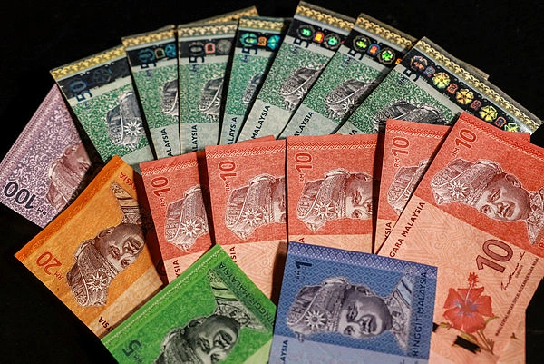 Ilustrasi grafik mata uang ringgit Malaysia terhadap dolar AS